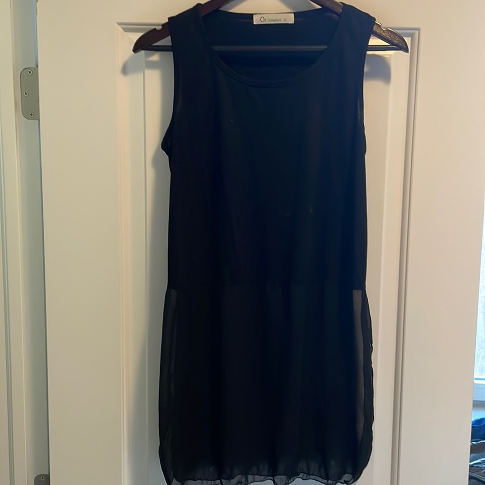 Black tank top with sheer bottom. Size L